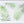 White linen placemat and napkin set embroidered with green le sud leaves, 100% European linen, handcrafted by Plein Soleil.