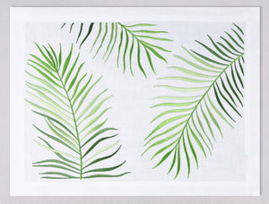 White linen placemat and napkin set embroidered with green le sud leaves, 100% European linen, handcrafted by Plein Soleil.
