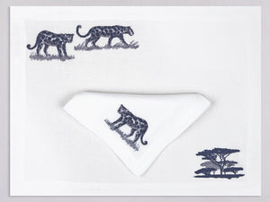 White linen placemat and napkin set embroidered with leopards and safari tree, 100% European linen, handcrafted by Plein Soleil.