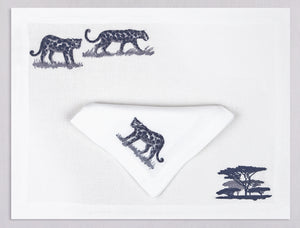 White linen placemat and napkin set embroidered with leopards and safari tree, 100% European linen, handcrafted by Plein Soleil.