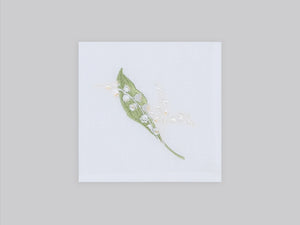 White linen cocktail napkin set embroidered with white and green lily flowers, 100% European linen, handcrafted by Plein Soleil.