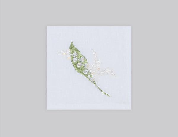 White linen cocktail napkin set embroidered with white and green lily flowers, 100% European linen, handcrafted by Plein Soleil.