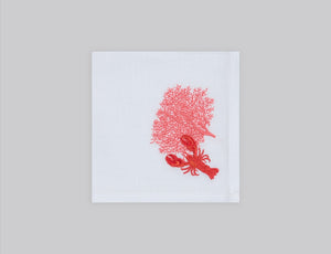 White cocktail napkin set embroidered with a salmon colored coral and red lobster, 100% European linen, handcrafted by Plein Soleil.