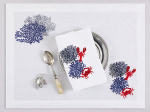 White linen placemat and napkin set embroidered with navy corals and red lobster and crab, 100% European linen, handcrafted by Plein Soleil.