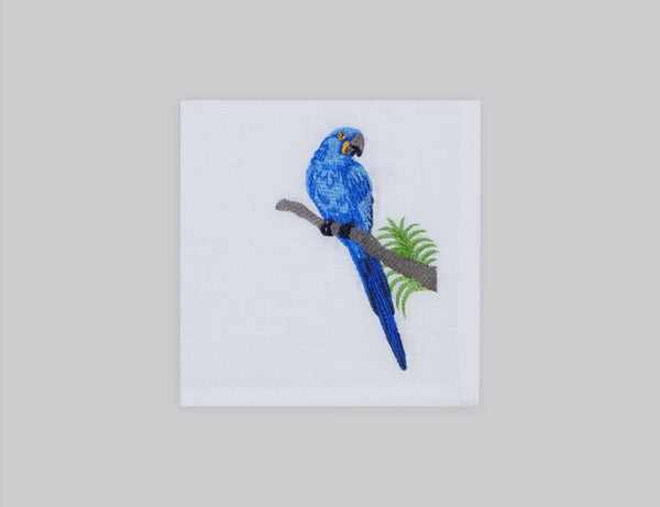 White linen cocktail napkin set embroidered with blue macau bird, 100% European linen, handcrafted by Plein Soleil.