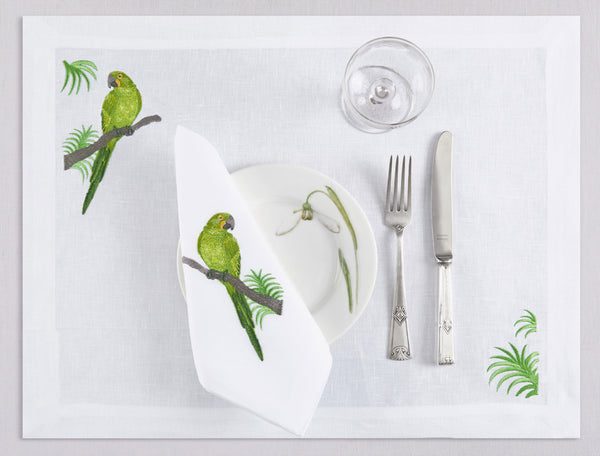 White linen placemat and napkin set embroidered with green macau bird, 100% European linen, handcrafted by Plein Soleil.