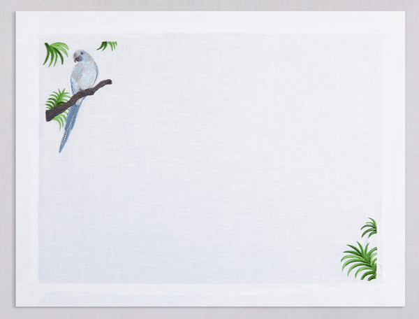 White linen placemat and napkin set embroidered with ice blue macau bird, 100% European linen, handcrafted by Plein Soleil.