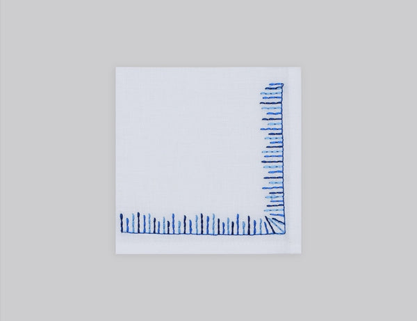 White linen cocktail napkin set embroidered with blue mikado motif border, 100% European linen, handcrafted by Plein Soleil.