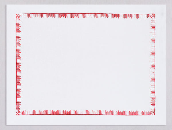 White linen placemat and napkin set embroidered with red mikado motif border, 100% European linen, handcrafted by Plein Soleil.