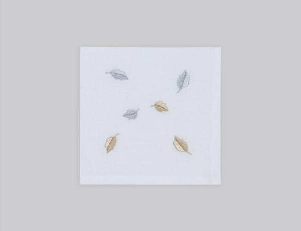 White linen cocktail napkin set embroidered with gold and silver small leaves, 100% European linen, handcrafted by Plein Soleil.