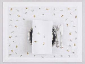 White linen placemat and napkin set embroidered with gold and silver small leaves, 100% European linen, handcrafted by Plein Soleil.