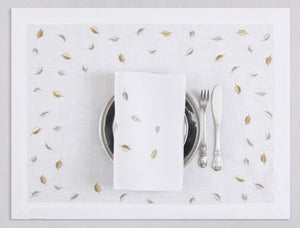 White linen placemat and napkin set embroidered with gold and silver small leaves, 100% European linen, handcrafted by Plein Soleil.