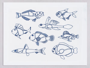 White linen placemat and napkin set embroidered with blue outline fish, 100% European linen, handcrafted by Plein Soleil.