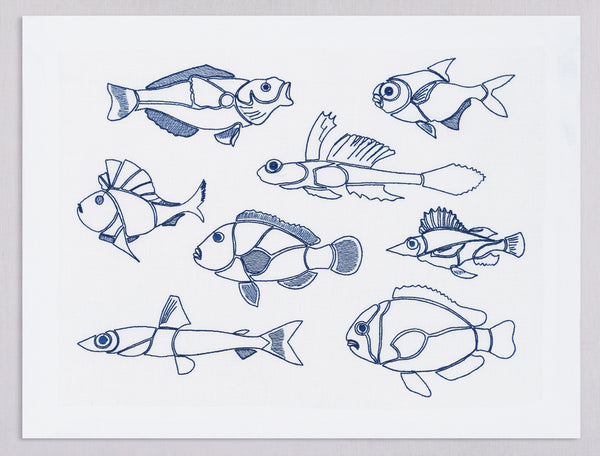White linen placemat and napkin set embroidered with blue outline fish, 100% European linen, handcrafted by Plein Soleil.