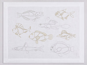 White linen placemat and napkin set embroidered with gold and silver outline fish, 100% European linen, handcrafted by Plein Soleil.
