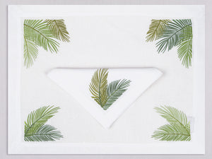 White linen placemat and napkin set embroidered with green palm branches, 100% European linen, handcrafted by Plein Soleil.