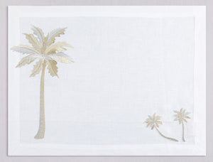 White linen placemat and napkin set embroidered with gold and silver palm trees, 100% European linen, handcrafted by Plein Soleil.