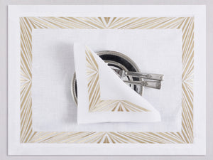 White linen placemat and napkin set embroidered with gold Paris motif border, 100% European linen, handcrafted by Plein Soleil.