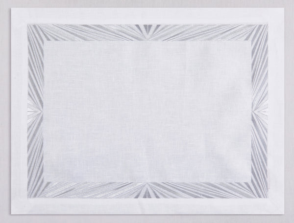 White linen placemat and napkin set embroidered with silver Paris motif border, 100% European linen, handcrafted by Plein Soleil.