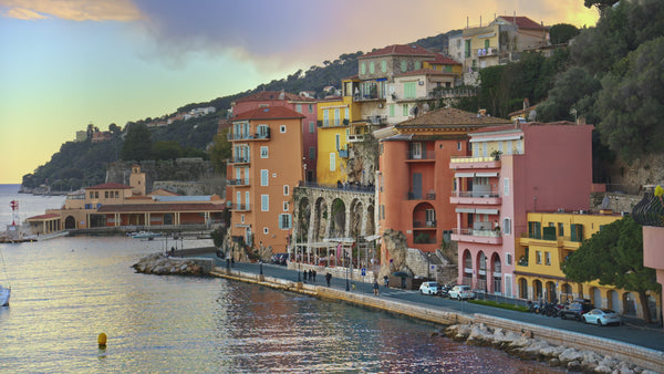 Banner for Plein Soleil’s Summer 25 Collection, featuring a sunlit French Riviera village evoking the coastal elegance and Mediterranean charm of the season.