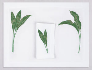 White linen placemat and napkin set embroidered with green banana leaves, 100% European linen, handcrafted by Plein Soleil.