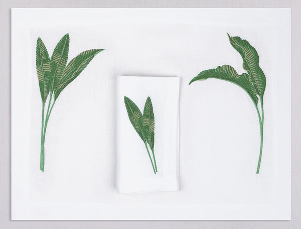 White linen placemat and napkin set embroidered with green banana leaves, 100% European linen, handcrafted by Plein Soleil.