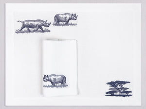 White linen placemat and napkin set embroidered with rhinos and safari trees, 100% European linen, handcrafted by Plein Soleil.