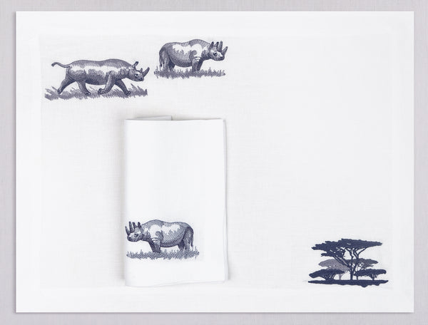 White linen placemat and napkin set embroidered with rhinos and safari trees, 100% European linen, handcrafted by Plein Soleil.