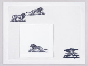 White linen placemat and napkin set embroidered with lions and safari trees, 100% European linen, handcrafted by Plein Soleil.