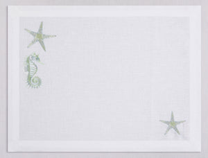 White linen placemat and napkin set embroidered with pistachio colored seahorse and starfish, 100% European linen, handcrafted by Plein Soleil.