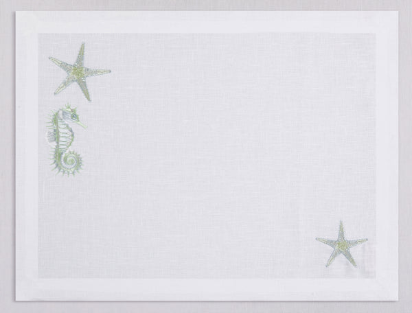 White linen placemat and napkin set embroidered with pistachio colored seahorse and starfish, 100% European linen, handcrafted by Plein Soleil.