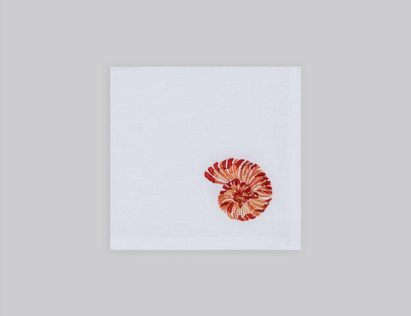 White linen cocktail napkin embroidered with orange shell, 100% European linen, handcrafted by Plein Soleil.