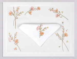 White linen placemat and napkin set embroidered with light pink flowers, 100% European linen, handcrafted by Plein Soleil.
