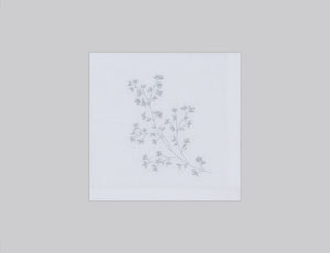 White linen cocktail napkin set embroidered with silver spring branches, 100% European linen, handcrafted by Plein Soleil.