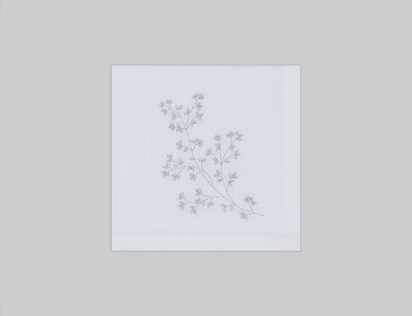 White linen cocktail napkin set embroidered with silver spring branches, 100% European linen, handcrafted by Plein Soleil.