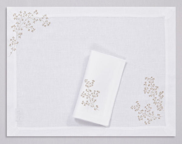 White linen placemat and napkin set embroidered with gold spring branches, 100% European linen, handcrafted by Plein Soleil.