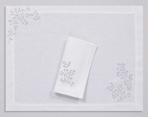 White linen placemat and napkin set embroidered with silver spring branches, 100% European linen, handcrafted by Plein Soleil.