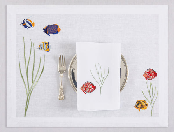 White linen placemat and napkin set embroidered with colorful tropic fish, 100% European linen, handcrafted by Plein Soleil.