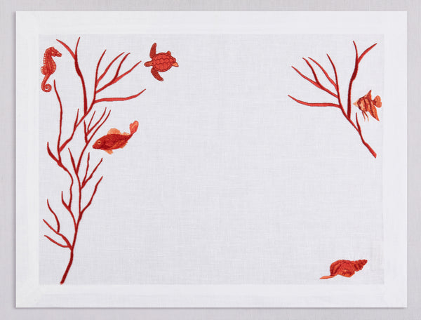 White linen placemat embroidered with red fish and corals, 100% European linen, handcrafted by Plein Soleil.