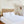 Versa Duvet Cover Set in white Egyptian cotton with geometric embroidery – flanged shams and pillowcases on bed, styled in luxury bedroom.