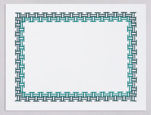 White linen placemat and napkin set embroidered with emerald versa geometric border, 100% European linen, handcrafted by Plein Soleil.