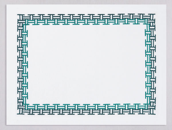 White linen placemat and napkin set embroidered with emerald versa geometric border, 100% European linen, handcrafted by Plein Soleil.