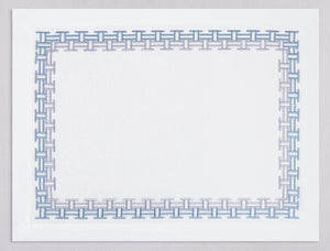 White linen placemat and napkin set embroidered with ice blue versa geometric border, 100% European linen, handcrafted by Plein Soleil.