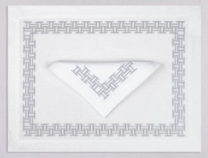 White linen placemat and napkin set embroidered with silver versa geometric border, 100% European linen, handcrafted by Plein Soleil.