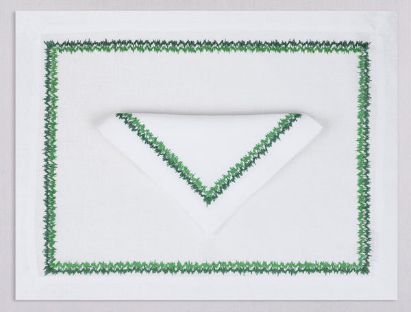 White linen placemat and napkin set embroidered with green zig zag motif border, 100% European linen, handcrafted by Plein Soleil.